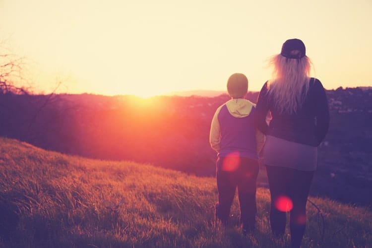 mother and her son standing in the nature
