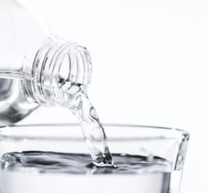 Pouring water into a glass