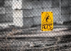 yellow sign on the fence