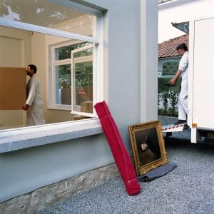 movers unloading the truck with items around them