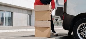 man carrying boxes