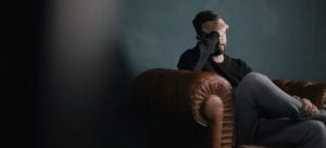 a man holding his head