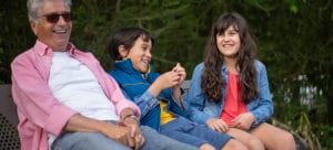 Grandfather laughing with the grandchildren