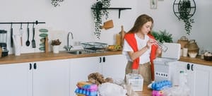  A woman packing kitchen items