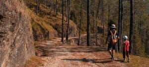 man and a child hiking 