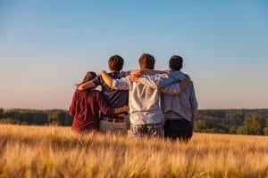 friends sitting on the ground