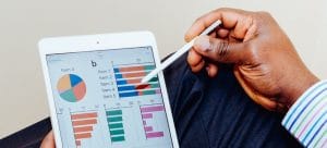 somebody holding an I-pad, trying to figure out how to manage a long distance relocation on budget