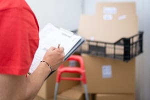 A man holding a checklist