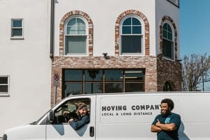 Movers from a moving company and a truck