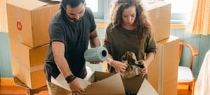 A couple packing fragile items
