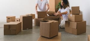 A couple with moving boxes