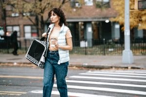 a woman carrying a pet carrier