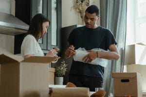 man and woman packing for the move