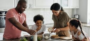 a family making breakfast in the kitchen to help their kids adapt after moving to henderson