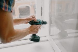 a person fixing the windows